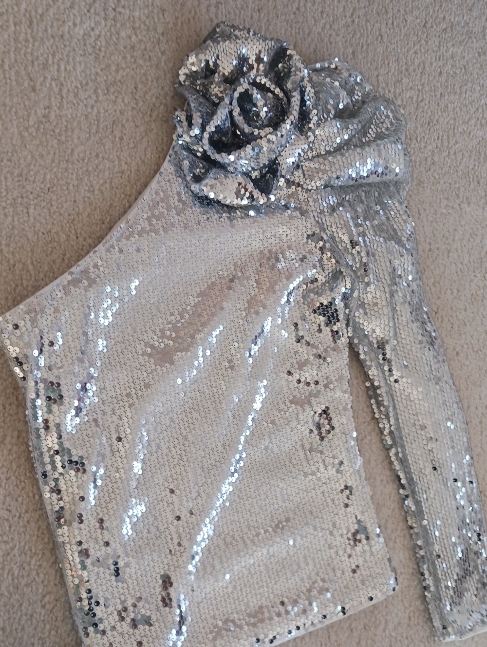 One-Shoulder Silver Sequin Top with Rosette Accent
